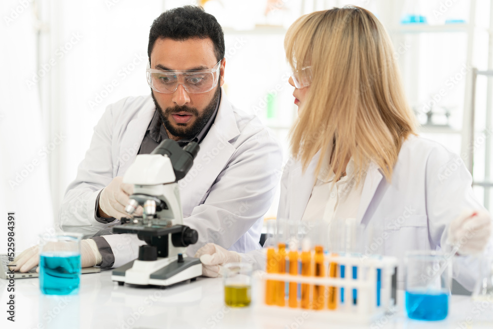 The scientist doctor created a vaccine against the coronavirus.Coronavirus 2019-nCoV Blood Sample. virus outbreaking.Technician holding blood tube test in the research laboratory The scientist doctor created a vaccine against the coronavirus.Coronavirus 2019-nCoV Blood Sample. virus outbreaking.Technician holding blood tube test in the research laboratory