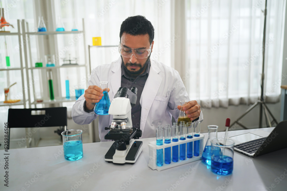 The scientist doctor created a vaccine against the coronavirus.Coronavirus 2019-nCoV Blood Sample. virus outbreaking.Technician holding blood tube test in the research laboratory The scientist doctor created a vaccine against the coronavirus.Coronavirus 2019-nCoV Blood Sample. virus outbreaking.Technician holding blood tube test in the research laboratory