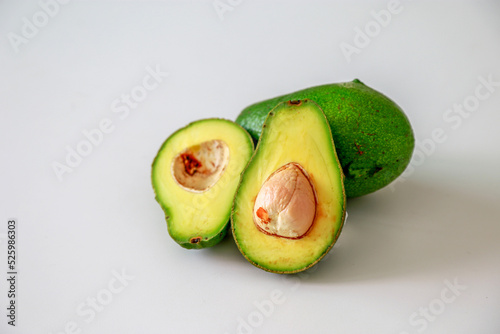 Group of sliced avocado on white background.