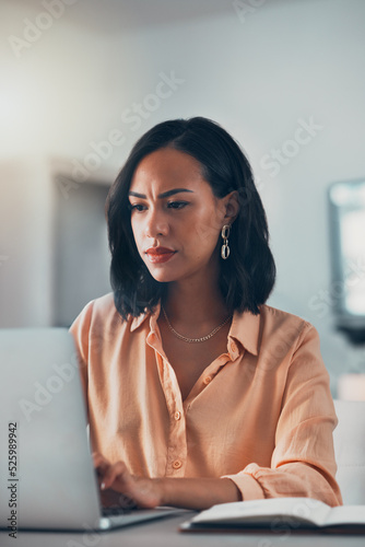 Working from home, serious and thinking woman, freelancer and entrepreneur doing remote work while planning ideas, email and browsing research online. Organized, professional and focused worker