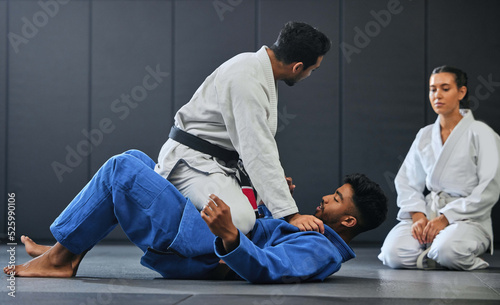 Obraz na plátně Karate, fitness and martial arts instructor teaching a lesson on fighting and defense training at a gym or indoor center