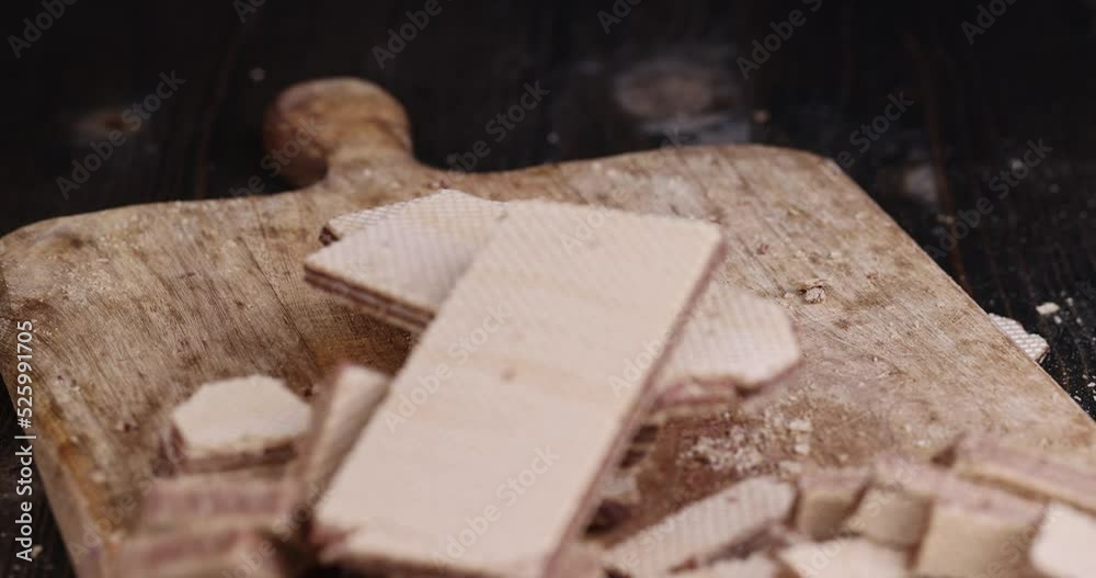 waffles with chocolate filling fall on the table, harmful sweet foods with chocolate filling on the board waffles with chocolate filling fall on the table, harmful sweet foods with chocolate filling on the board