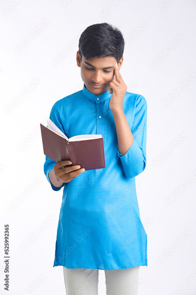 Indian college student holding diary in hand on white background. Indian college student holding diary in hand on white background.