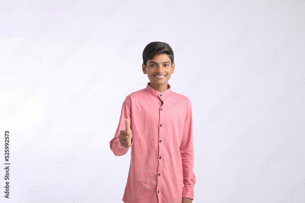 Indian college boy giving expression on white background. Indian college boy giving expression on white background.