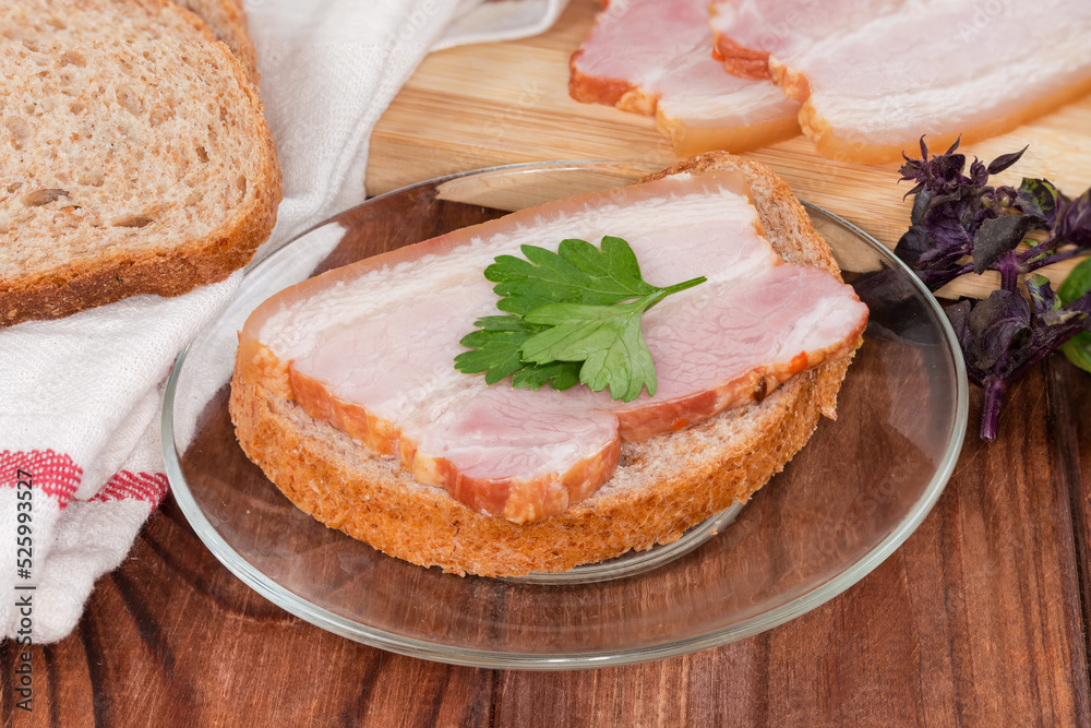 Open sandwich with boiled smoked pork belly against ingredients