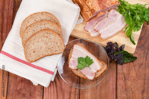 Boiled smoked pork, grain bread and open sandwich, top view