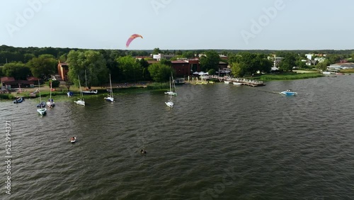 Aerial View of Kiteboarder, Boats and Coast of Zagrze Water Reservoair and Lake, Poland, Drone Shot photo