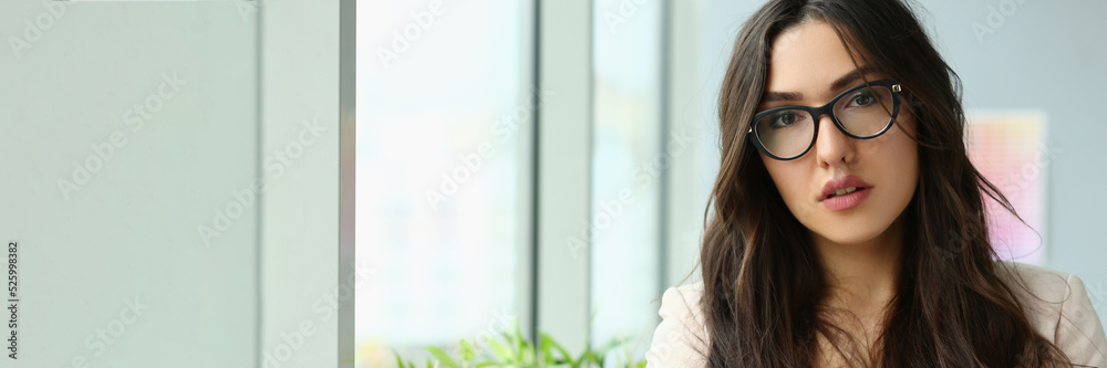 Beautiful smiling girl at workplace look in camera Beautiful smiling girl at workplace look in camera