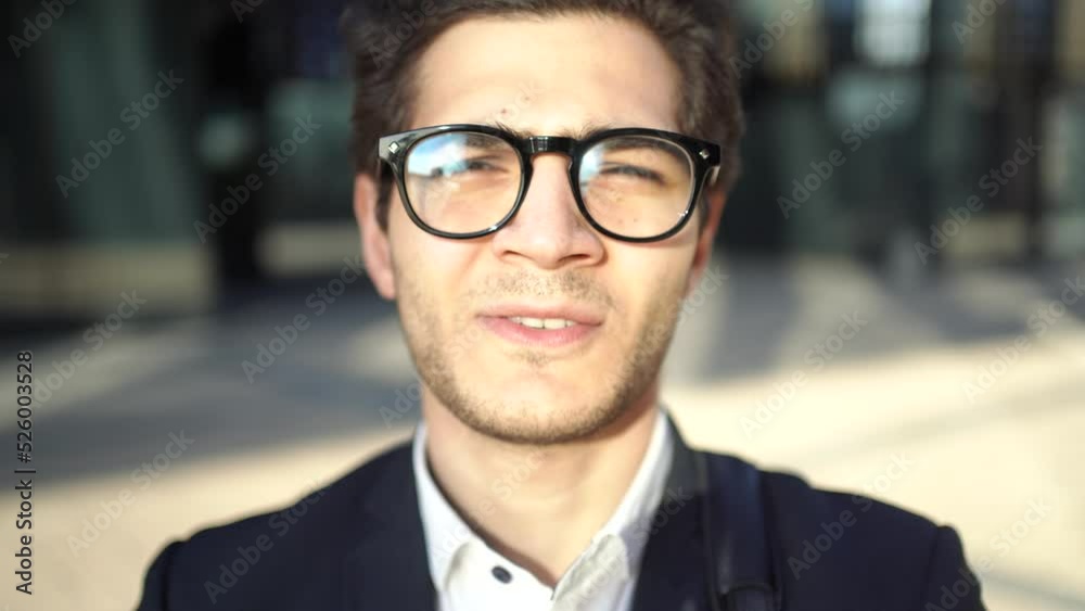 Portrait of a business man with glasses working sees the office in a formal suit Portrait of a business man with glasses working sees the office in a formal suit