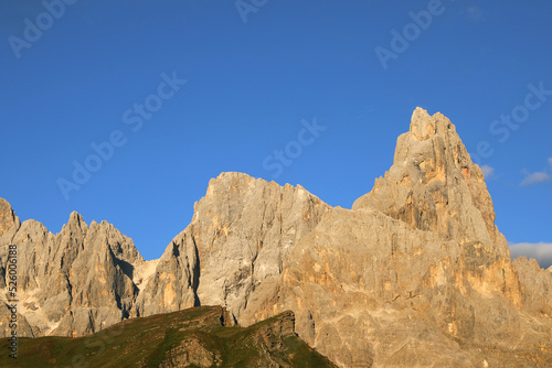 Breathtaking view of the Dolomites with the peak called Cimon della pala and the orange color at sunset