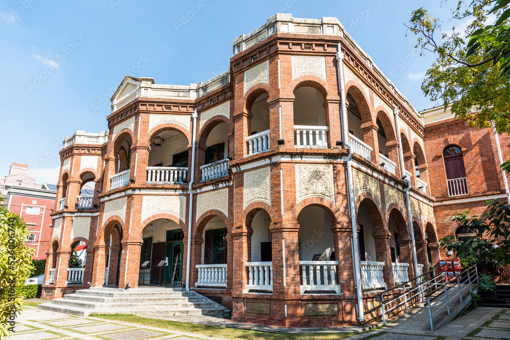Building exterior of the Old Tainan Magistrate Residence in Taiwan. The residence is a two-story building with an English colonial architectural style.