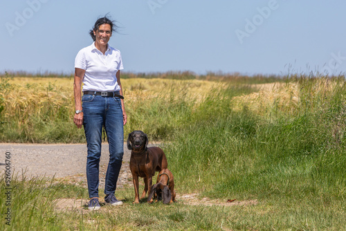 woman with two tracker dogs