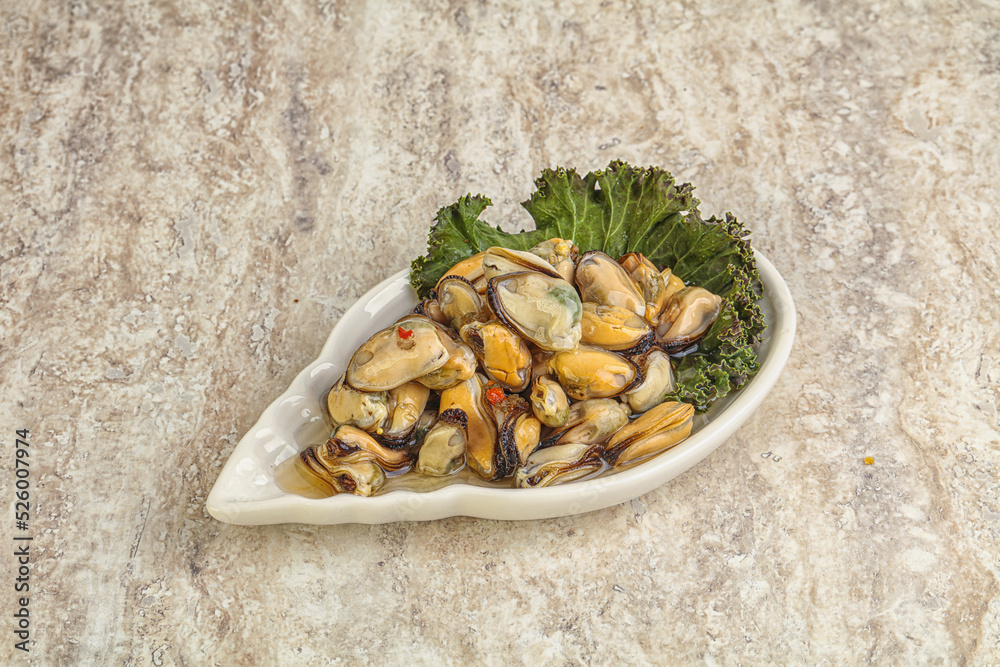Tasty marinated mussels in the bowl