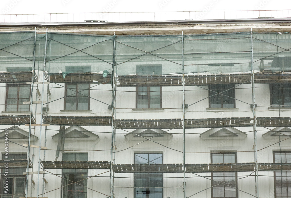 Scaffolding near the wall of a multi-storey building.