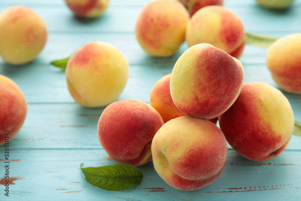 Fresh peaches on a old blue background. Space for text