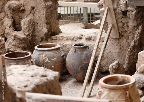 Obraz na plátne Recovered ancient pottery in prehistoric town of Akrotiri, excavation site of a