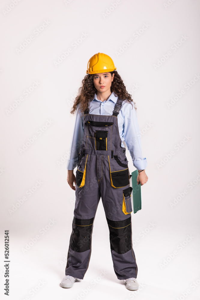 Girl builder with wood planks in their hands and circular saw. isolated Girl builder with wood planks in their hands and circular saw. isolated