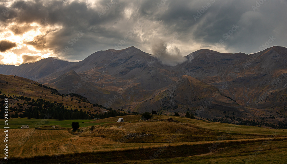 the col de festre ,in the deloluy area of France , with threatening storm clouds on the moutains