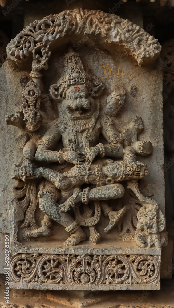 The Carving Sculpture of  Lord Narshimha Cutting the Stomach of Demon Hiranyakshipu, Lakshminarshimha Temple, Javagal, Hassan, Karnataka, India.