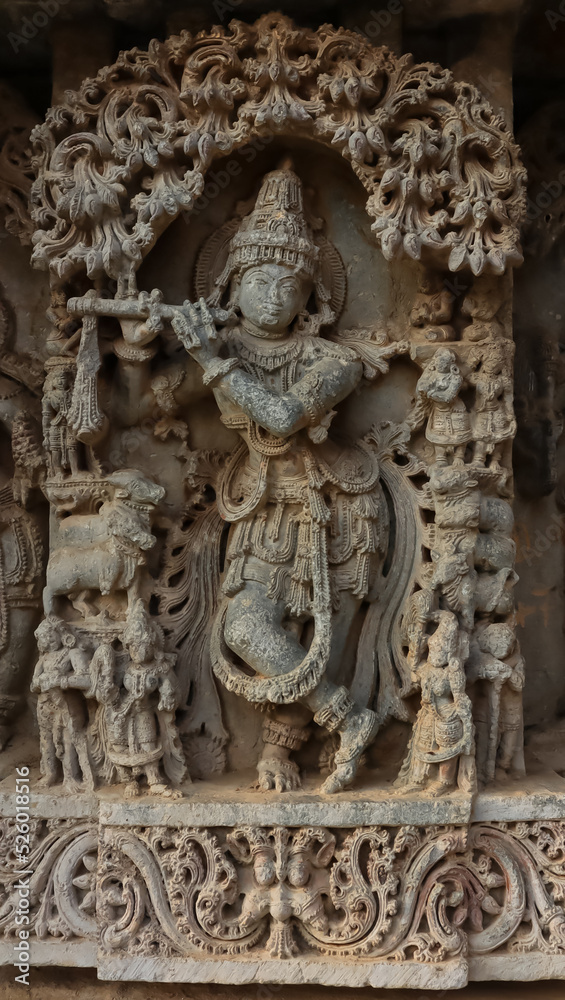 The Beautiful Sculpture of Lord Krishna Playing a Flute, Lakshminarshimha Temple, Javagal, Hassan, Karnataka, India.