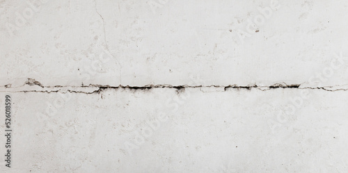 Texture white concrete wall has cracks