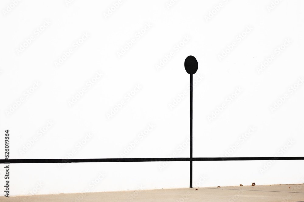 Signpost shade on white wall on street Signpost shade on white wall on street