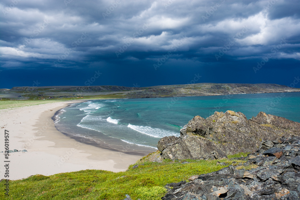 Stormy clouds over beautiful sandy beach in Sandfjordneset Nature Reserve, Norway