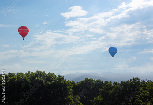 Hot air balloon in flight with clear sky