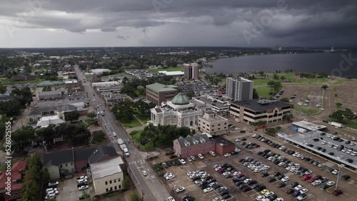 Aerial view of a courthouse in Lake Charles, LA with a storm in the background photo