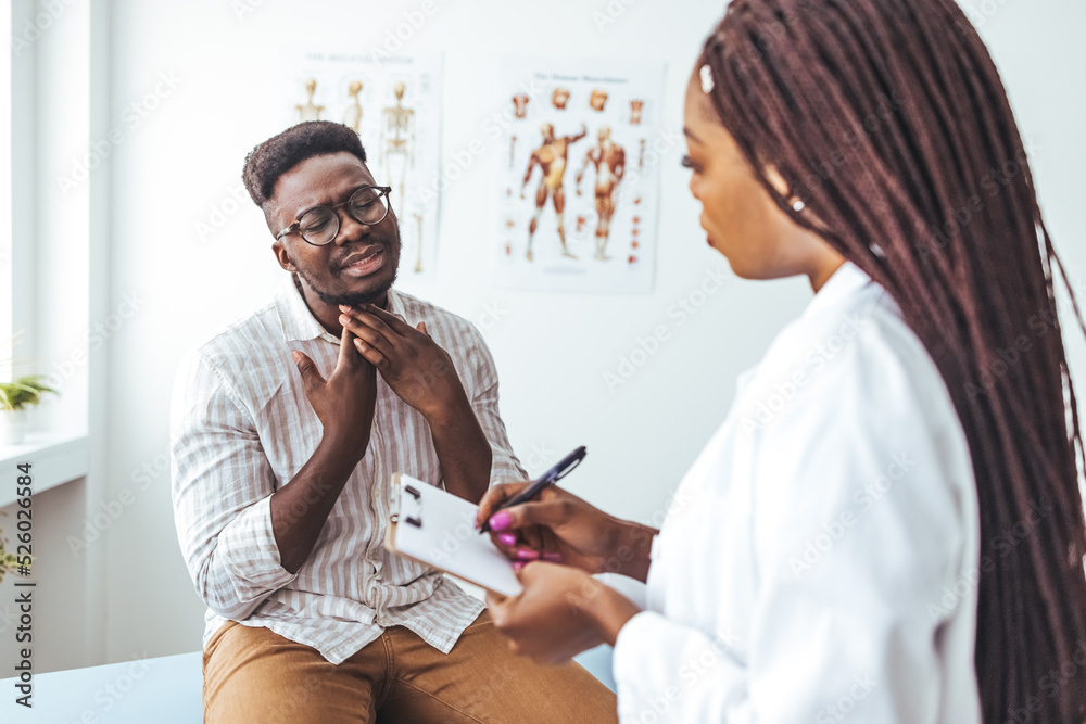 Obraz premium African american mid adult man with eyes closed touching painful throat against white background. copy space, throat, thyroid, medical, pain, sickness and healthcare concept. 