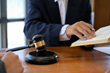 Close-up, A male lawyer or legal advisor working or reading law book in office