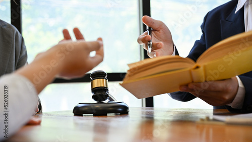 Canvas Print A professional male lawyer is counseling a business legal to his client in his office