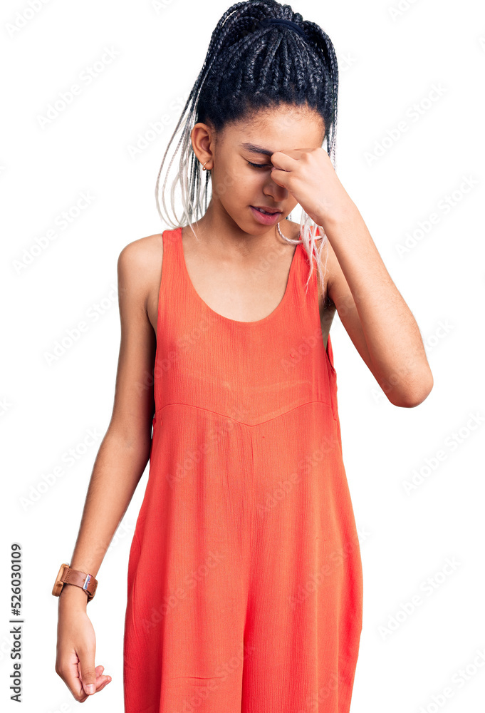 Cute african american girl wearing casual clothes tired rubbing nose and eyes feeling fatigue and headache. stress and frustration concept. Cute african american girl wearing casual clothes tired rubbing nose and eyes feeling fatigue and headache. stress and frustration concept.