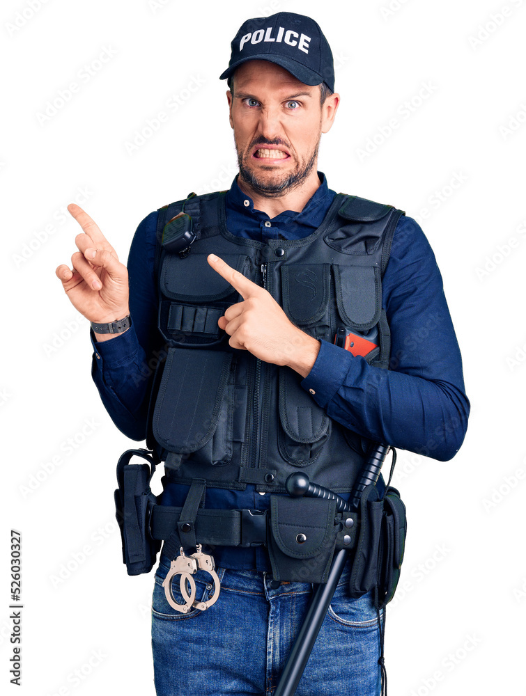 Young handsome man wearing police uniform pointing aside worried and nervous with both hands, concerned and surprised expression Young handsome man wearing police uniform pointing aside worried and nervous with both hands, concerned and surprised expression