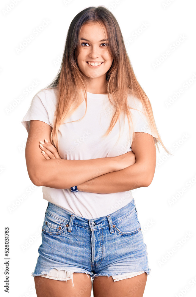 Beautiful caucasian woman wearing casual white tshirt happy face smiling with crossed arms looking at the camera. positive person. Beautiful caucasian woman wearing casual white tshirt happy face smiling with crossed arms looking at the camera. positive person.