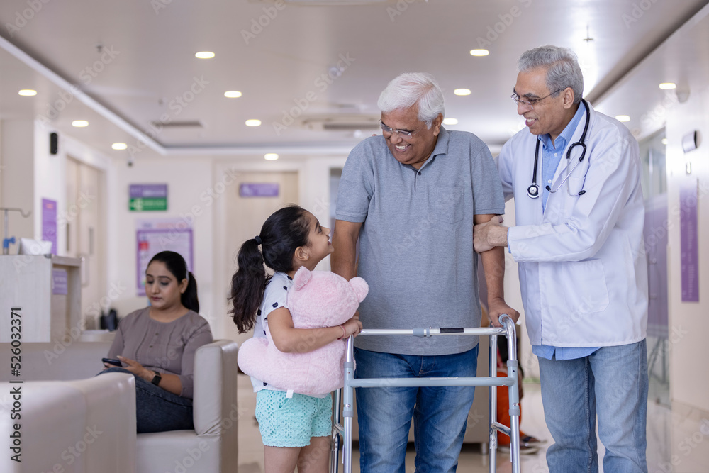custom made wallpaper toronto digitalGranddaughter with male doctor teaching disabled grandfather to use walker at hospital
