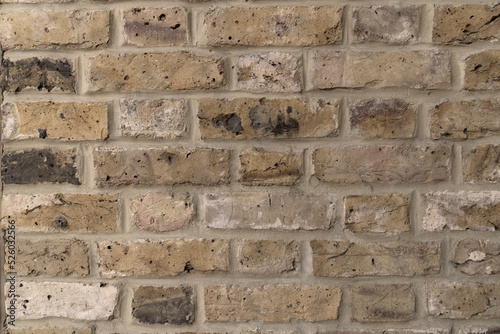Closeup different colored evenly brick wall background
