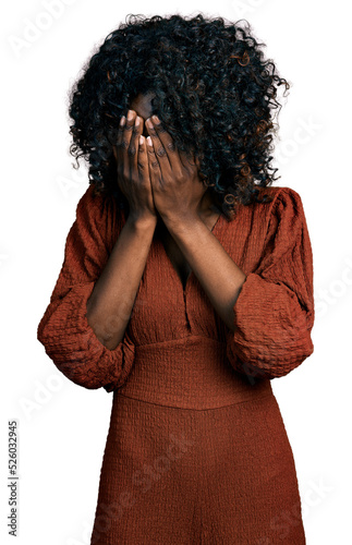 Wallpaper Mural African woman with curly hair wearing casual dress with sad expression covering face with hands while crying