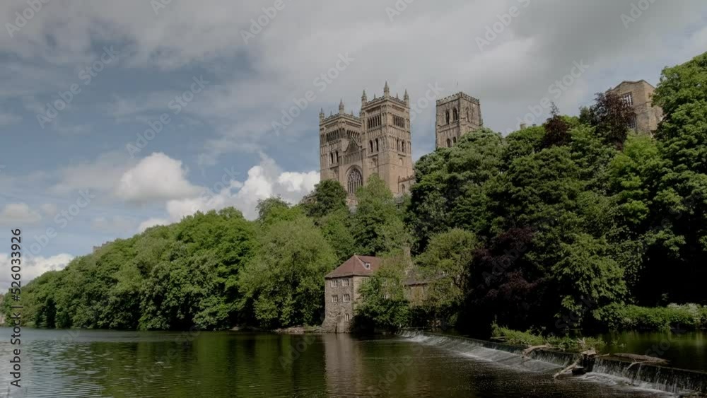 Wide low angle shot of weir and Durham Cathedral on sunny summer day Wide low angle shot of weir and Durham Cathedral on sunny summer day