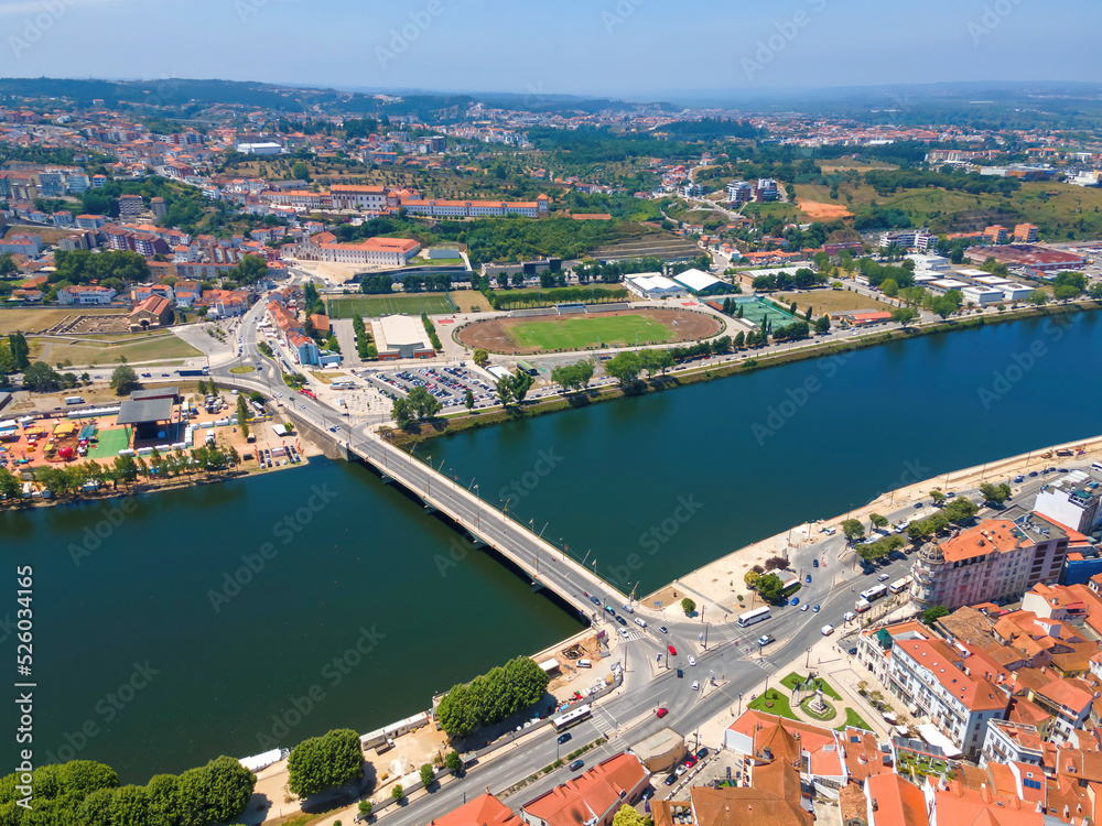 An aerial view of Santa Clara Bridge over Mondego River in Coimbra