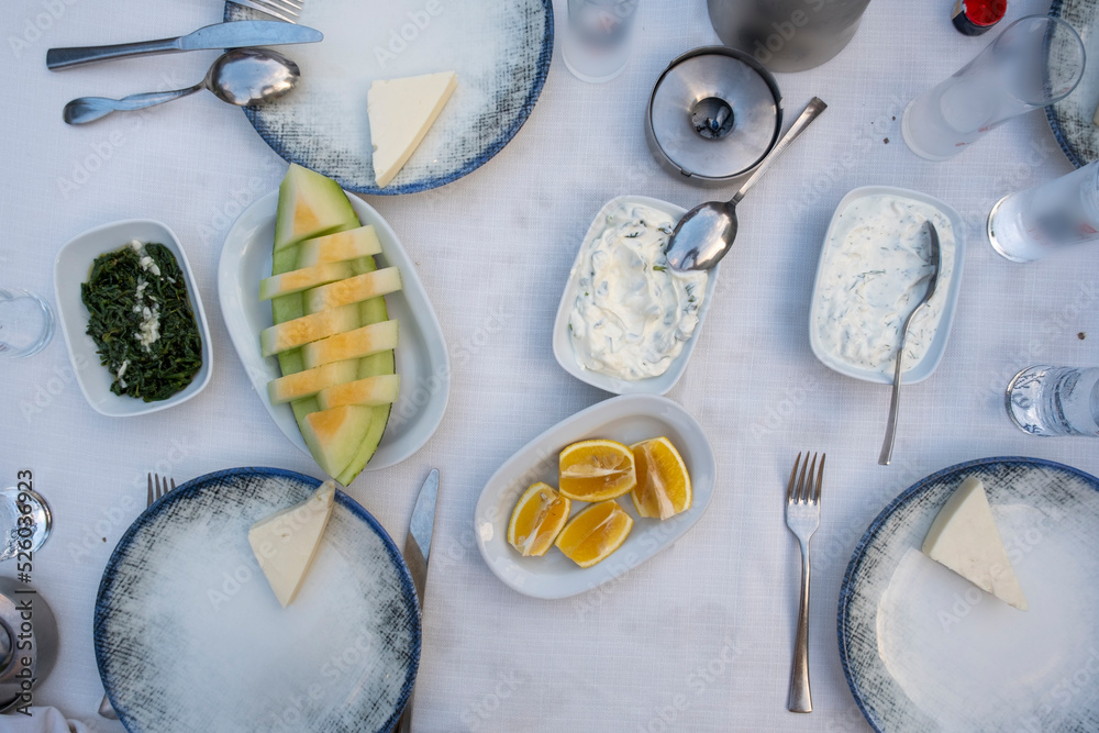 Turkish Raki table with melon, lemon and appetizer, traditional Turkish ...