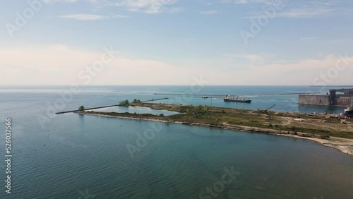 Panoramic Aerial View of Port Colborne Industrial Harbour in the Area of Nickel Beach Ontario Canada, Boat Cargo Freight Ship Sailing on Canal of Gravelly Bay at Lake Erie, Industrial Lakeside Area  photo