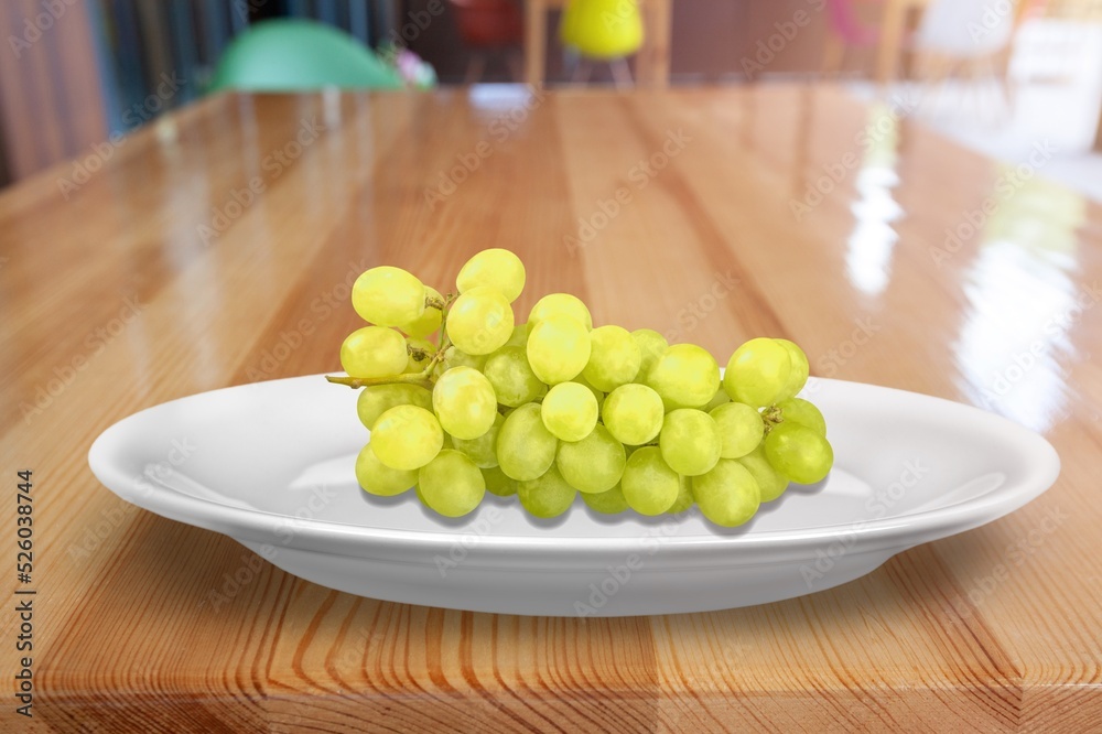 Tasty sweet aroma ripe grapes on a plate Tasty sweet aroma ripe grapes on a plate