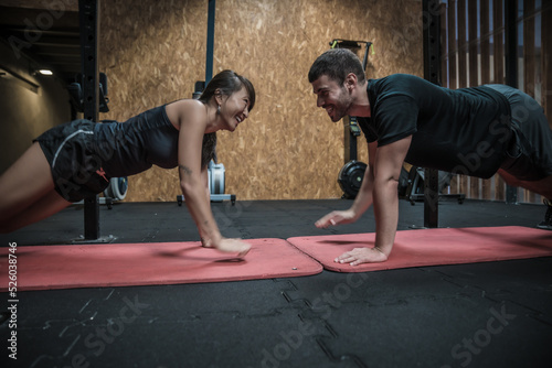 woman exercising workout with her coach