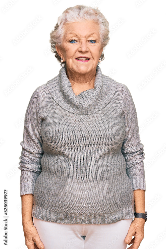 Senior grey-haired woman wearing casual winter sweater with a happy and cool smile on face. lucky person. Senior grey-haired woman wearing casual winter sweater with a happy and cool smile on face. lucky person.