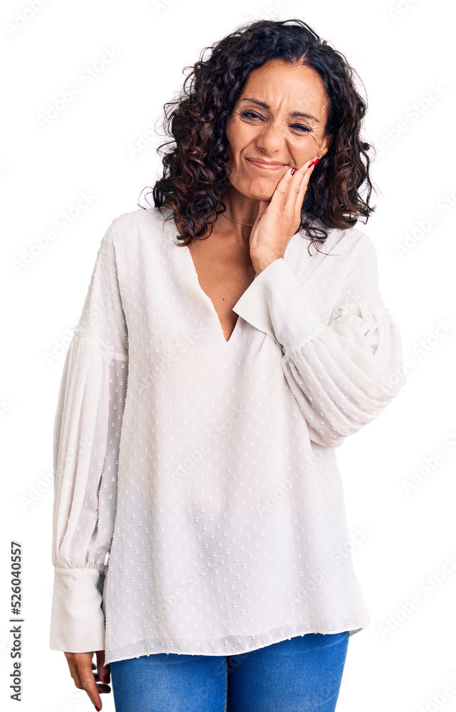 Middle age beautiful woman wearing casual sweater touching mouth with hand with painful expression because of toothache or dental illness on teeth. dentist Middle age beautiful woman wearing casual sweater touching mouth with hand with painful expression because of toothache or dental illness on teeth. dentist