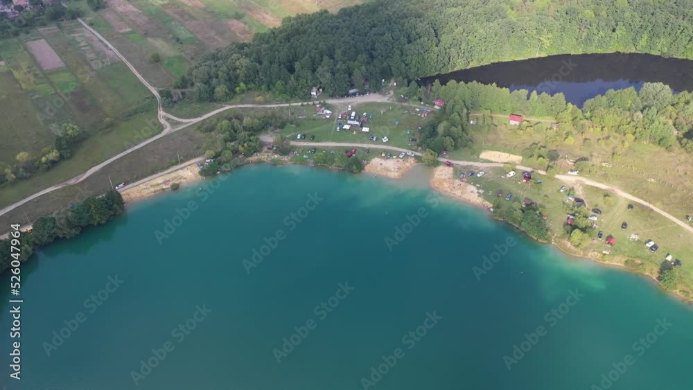 Lake with blue water. Lake in an abandoned quarry with blue water. Beach on a flooded quarry. The flooded quarry is a resting place and a beach. Lake with blue water. Lake in an abandoned quarry with blue water. Beach on a flooded quarry. The flooded quarry is a resting place and a beach.