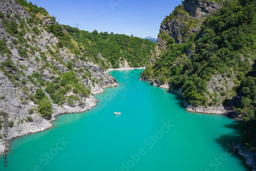 The lake Monteynard, the Panaroma from Himalayan Bridge, France , Isère. Little boat alone with nature.