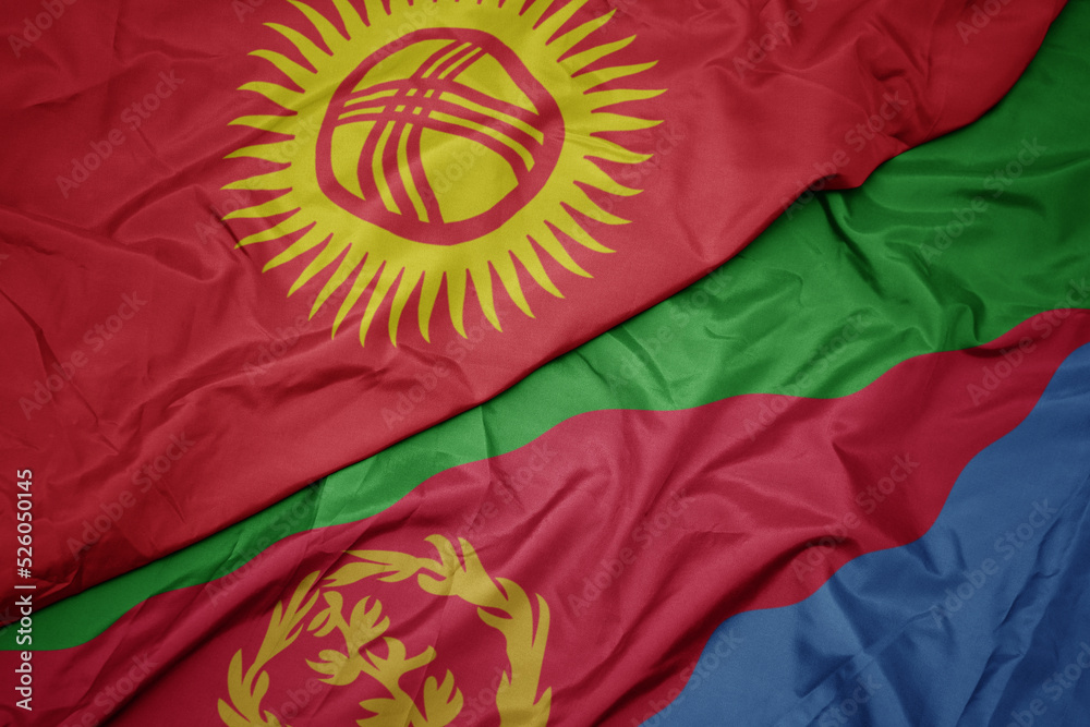 waving colorful flag of eritrea and national flag of kyrgyzstan.