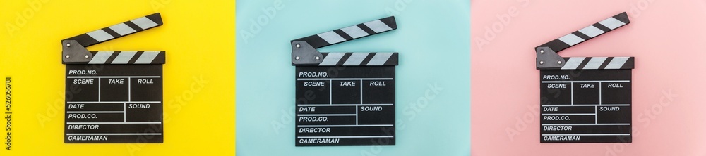 Filmmaker profession. Classic director empty film making clapperboard or movie slate Isolated on colourful yellow blue pink background. Video production film cinema industry concept. Banner mock up